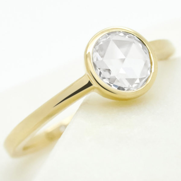 Bezel set rose cut diamond engagement ring set in yellow gold
